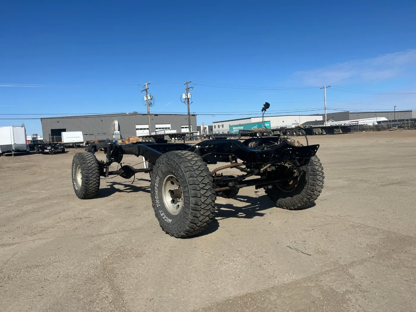 Bare rolling chassis on 4x4 tires after frame work