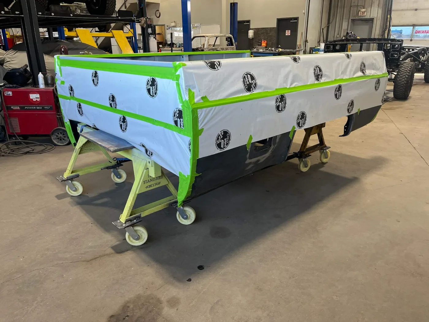 Truck box masked and taped, ready for paint in the NCC Classic shop