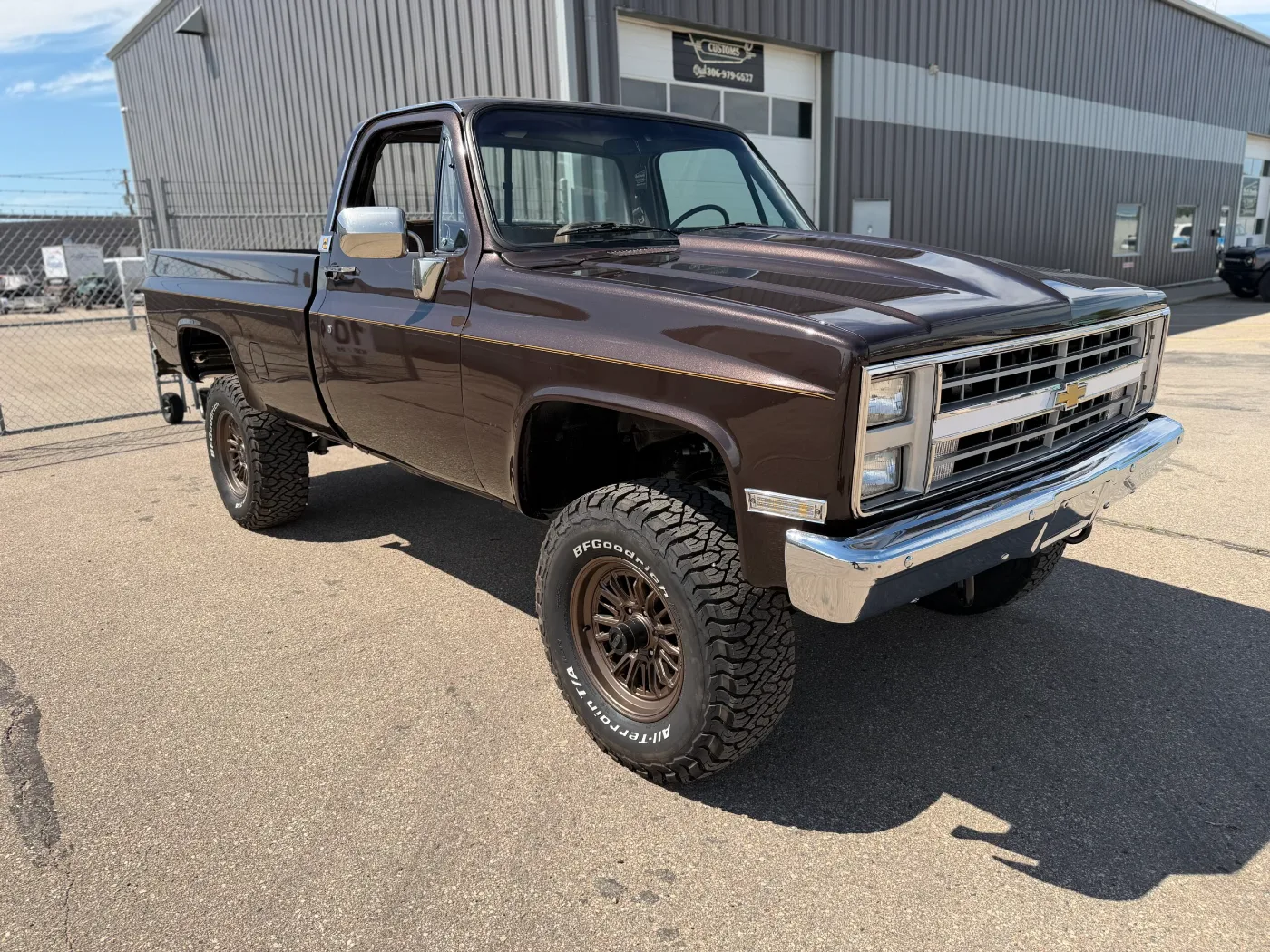 Brown Chevrolet square-body 4x4 pickup built by North Country Customs