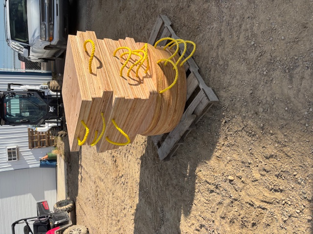 Stack of wooden outrigger pads on a pallet